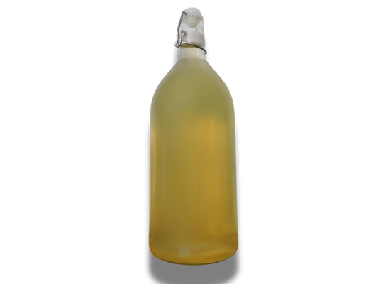 Yellow bottle with a white cap on a white background